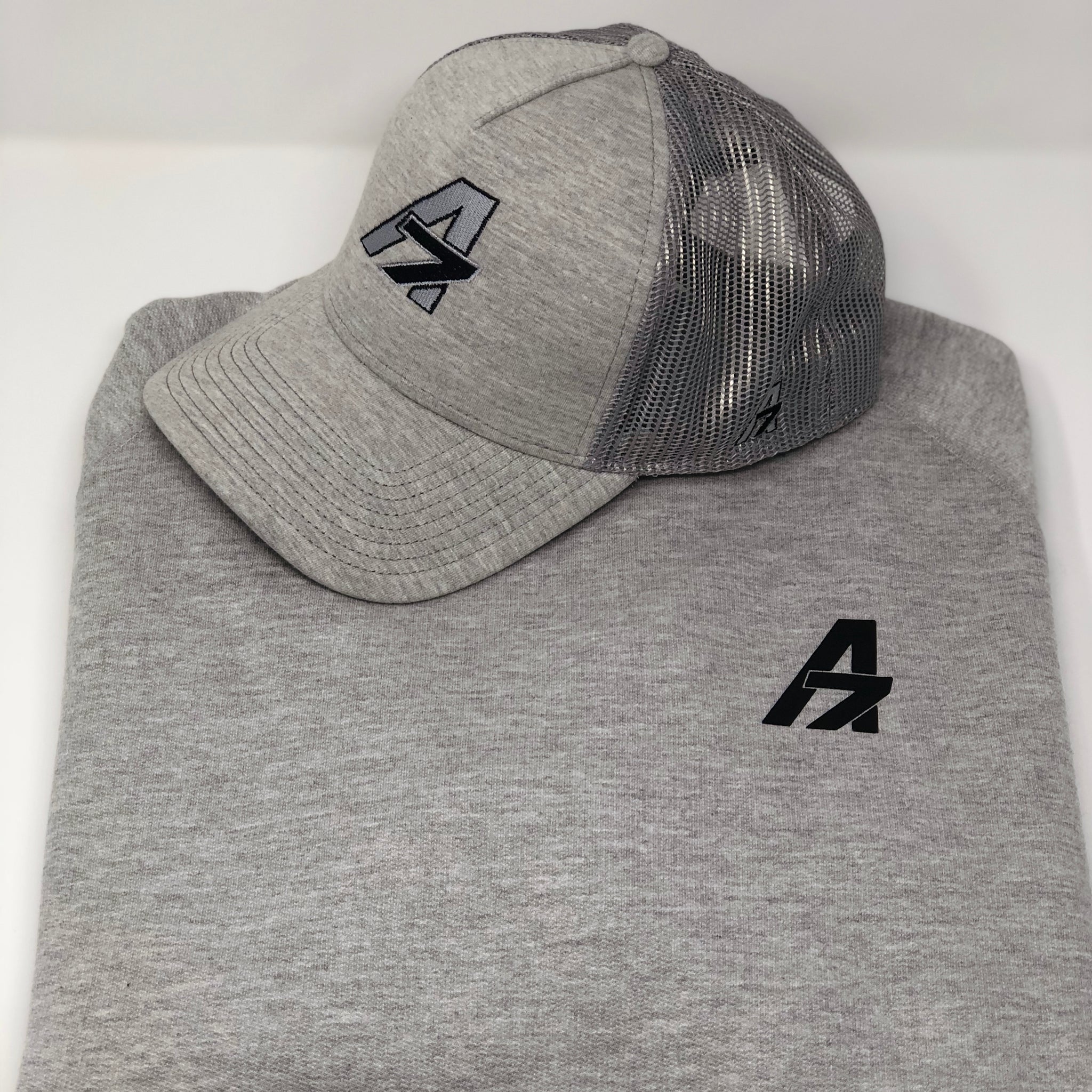 A7 Asher Grey Trucker hat, with Black embroidered  A7 logo